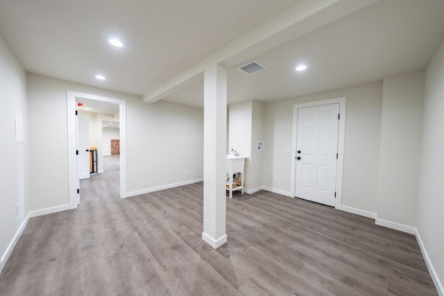 basement featuring wood-type flooring