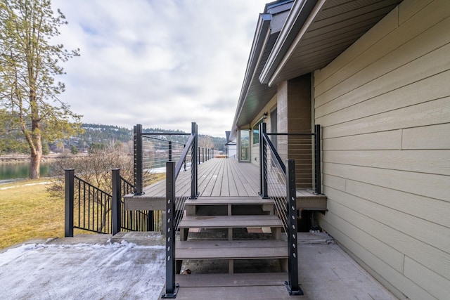 wooden deck featuring a water view