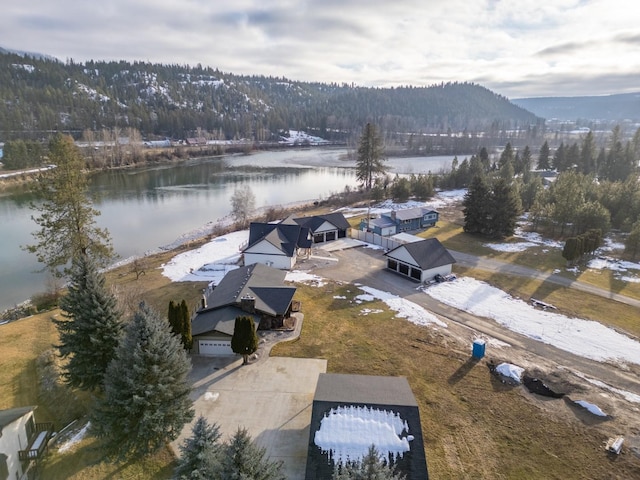 birds eye view of property featuring a water and mountain view