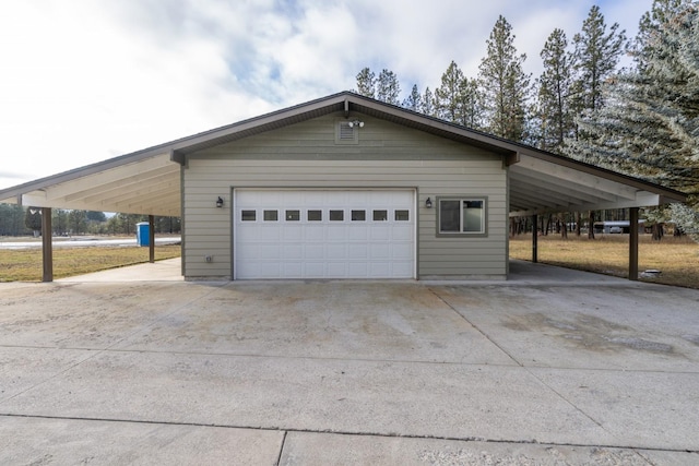 garage featuring a carport