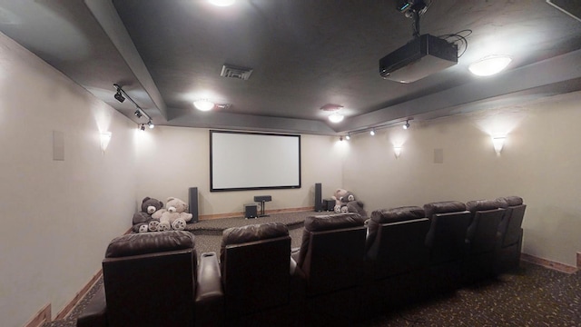 home theater room featuring track lighting