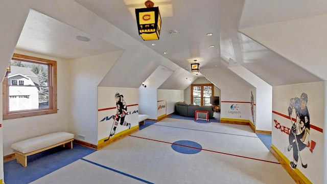 recreation room featuring lofted ceiling and light carpet