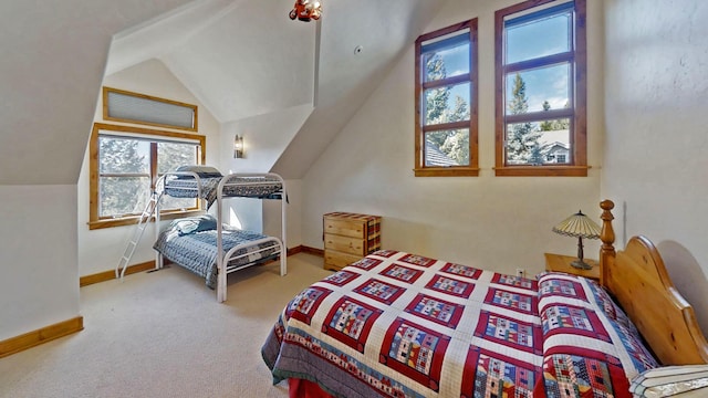 carpeted bedroom featuring vaulted ceiling