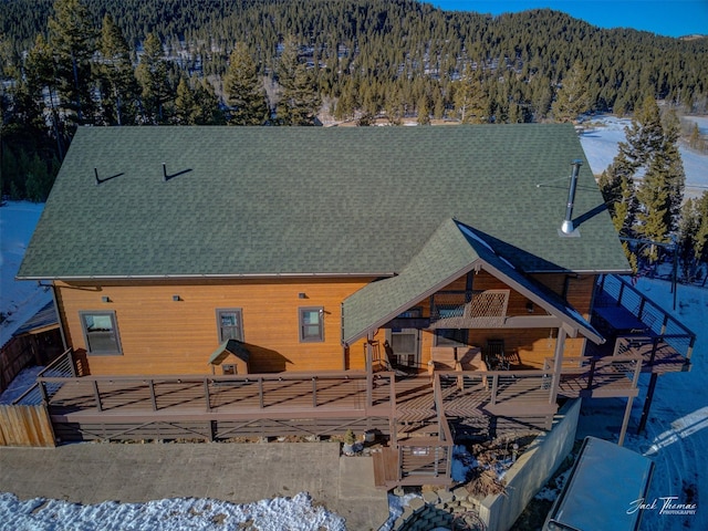 snow covered property with a mountain view