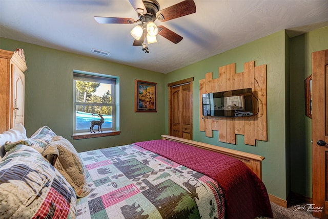 bedroom with ceiling fan and carpet flooring