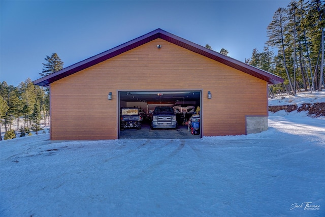 view of snow covered garage