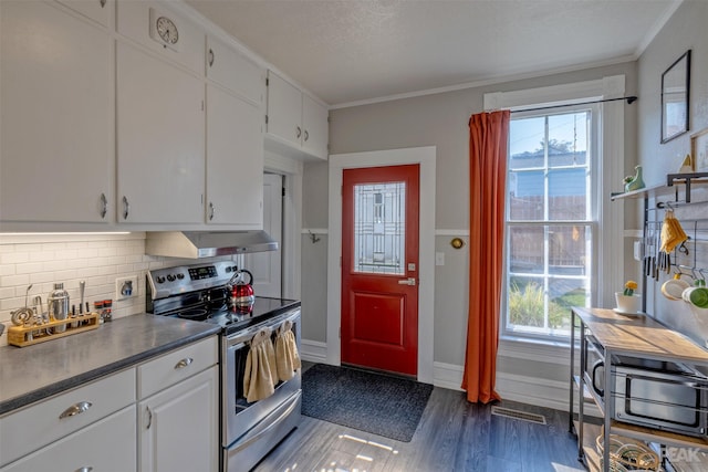 kitchen with tasteful backsplash, electric range, ornamental molding, dark hardwood / wood-style floors, and white cabinets