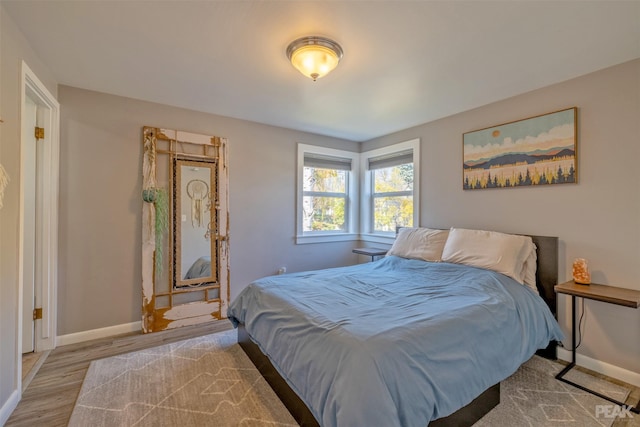 bedroom with light hardwood / wood-style floors