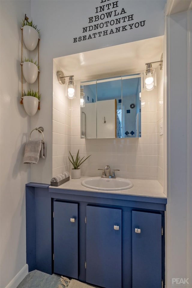 bathroom with vanity and decorative backsplash