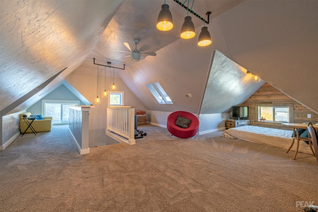 additional living space with lofted ceiling, carpet flooring, and a textured ceiling