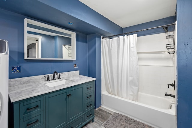 bathroom with vanity, hardwood / wood-style floors, and shower / bath combination with curtain