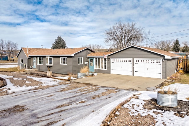 single story home with a garage