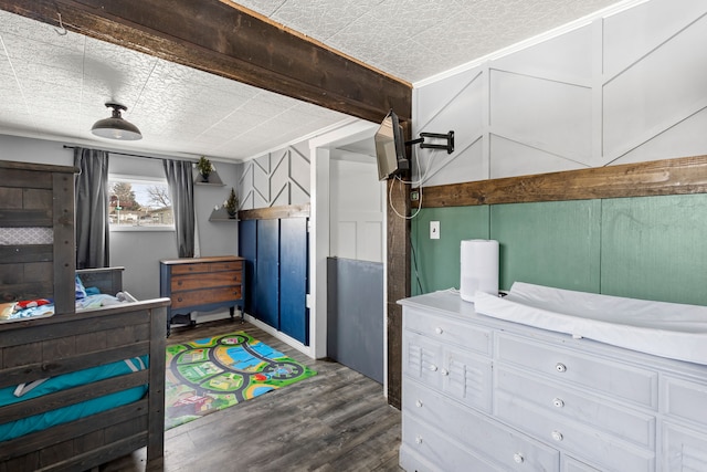 bedroom featuring dark hardwood / wood-style flooring