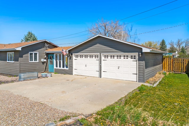 ranch-style home featuring an attached garage