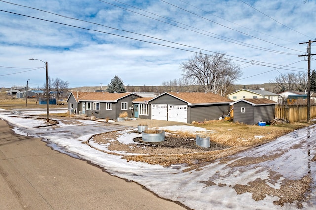 single story home featuring a garage