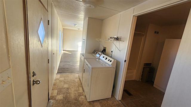 laundry area with washing machine and clothes dryer