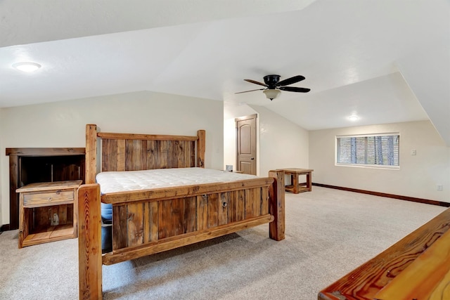 carpeted bedroom featuring ceiling fan and vaulted ceiling