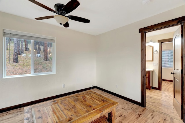 spare room featuring ceiling fan and light wood-type flooring