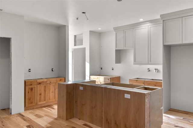 331 Baker Ave Ste 202, Whitefish, MT 59937 - kitchen featuring light wood-style flooring, a center island, and recessed lighting