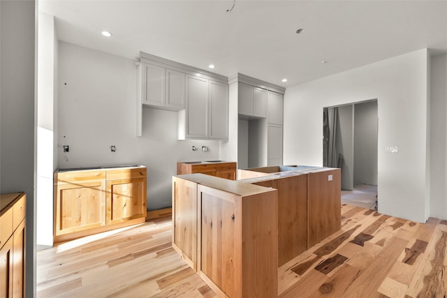 331 Baker Ave Ste 202, Whitefish, MT 59937 - kitchen with a kitchen island, light wood finished floors, and recessed lighting