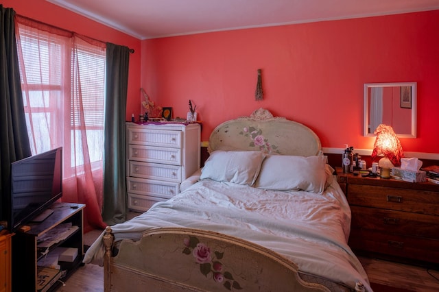 bedroom with hardwood / wood-style flooring