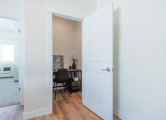 hallway featuring light hardwood / wood-style flooring