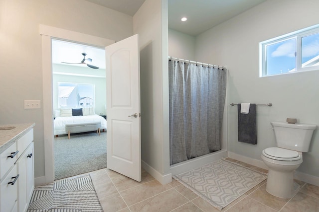 bathroom with a shower with curtain, tile patterned floors, a healthy amount of sunlight, and vanity