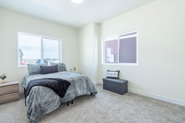 bedroom featuring light colored carpet