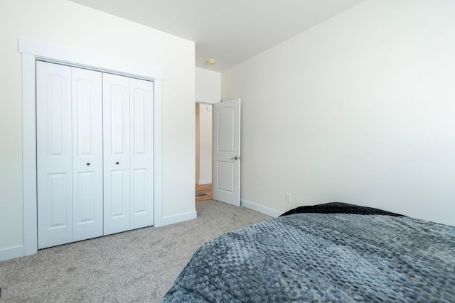 carpeted bedroom featuring a closet