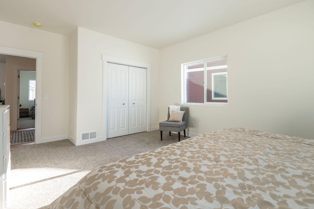 unfurnished bedroom with carpet flooring and a closet