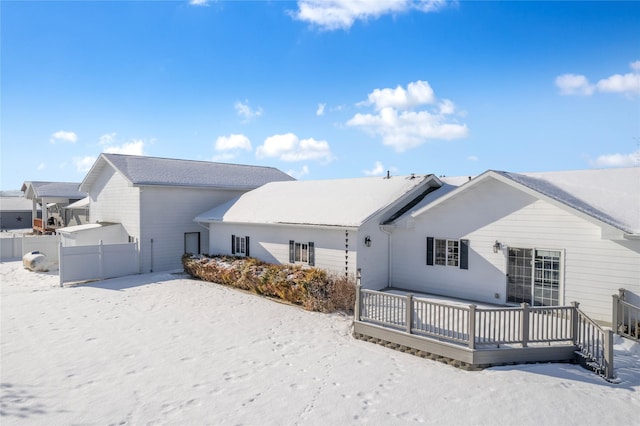 view of snow covered house