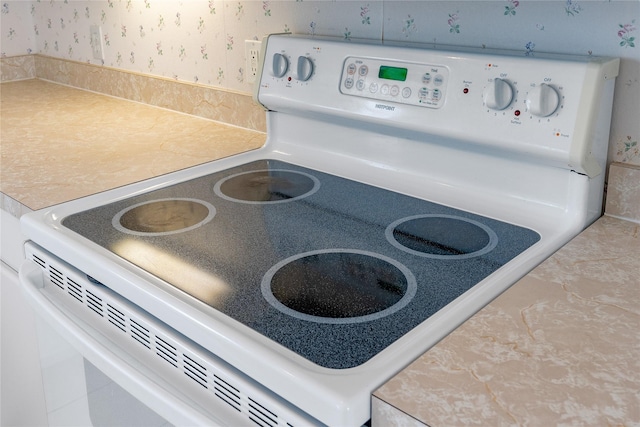 details featuring white range with electric stovetop