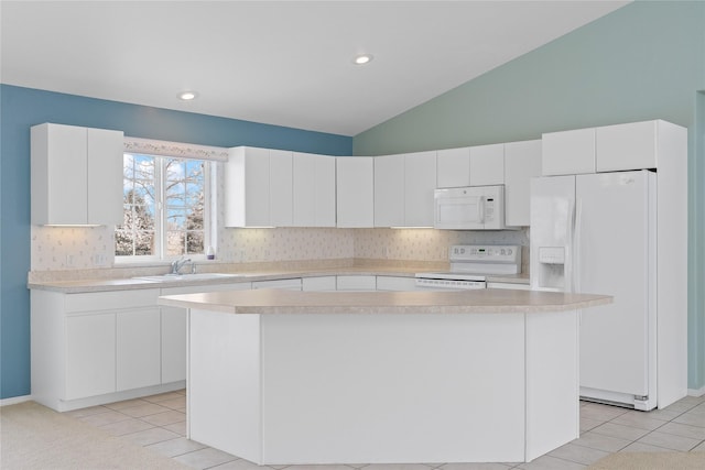 kitchen with white cabinetry, a center island, and white appliances