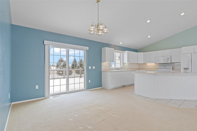 kitchen with white cabinetry, white appliances, light colored carpet, and pendant lighting