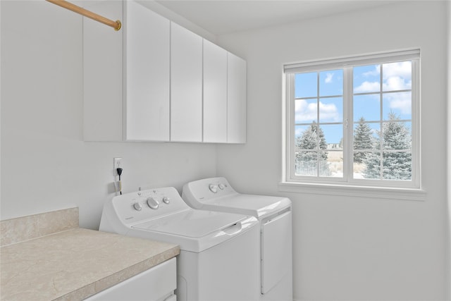 laundry area with cabinets and washer and dryer