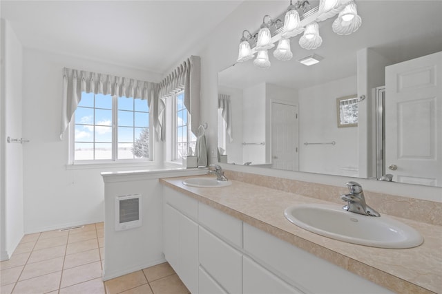 bathroom featuring tile patterned flooring and vanity