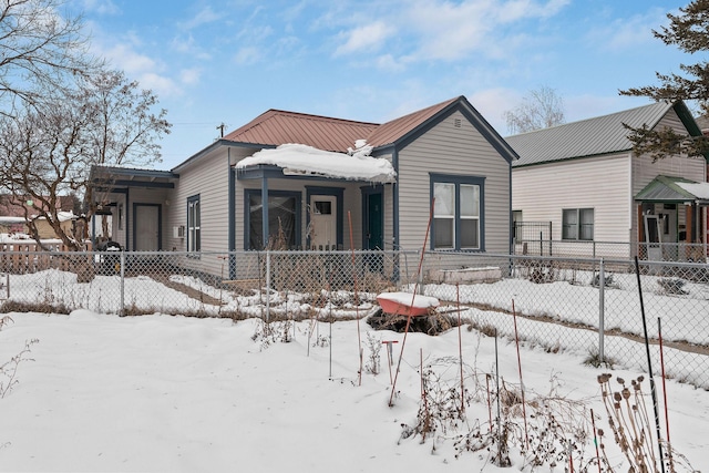 view of snow covered house