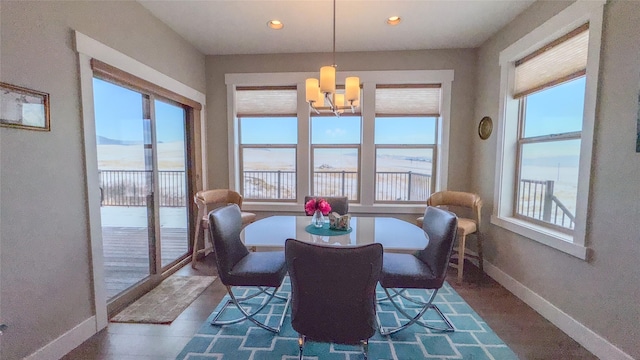 dining space featuring an inviting chandelier