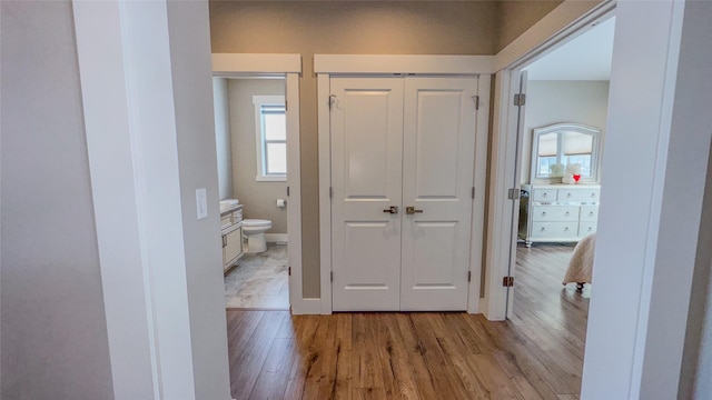 hall with light hardwood / wood-style flooring