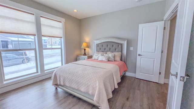 bedroom with hardwood / wood-style flooring