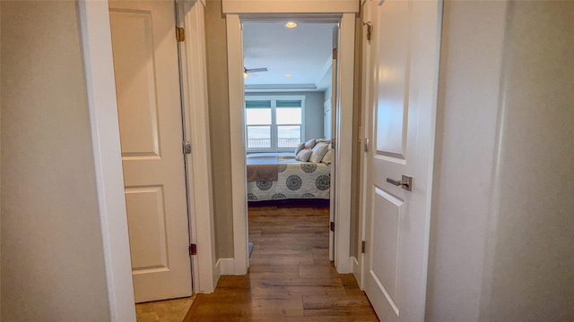 corridor featuring hardwood / wood-style floors