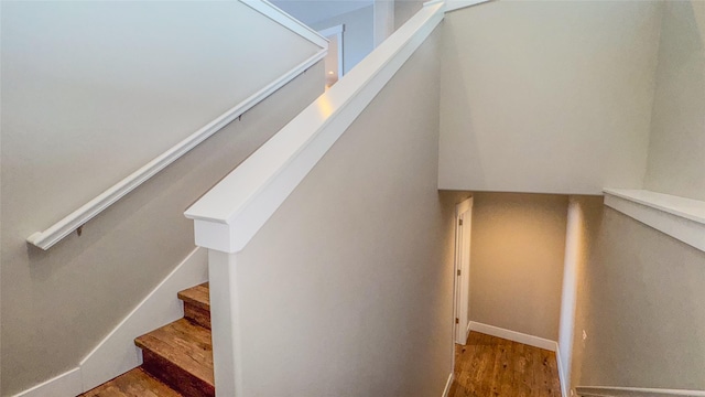 stairway featuring hardwood / wood-style floors