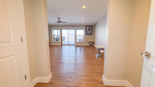 hall with hardwood / wood-style floors