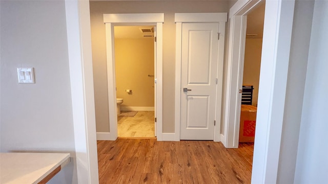 corridor featuring light hardwood / wood-style flooring