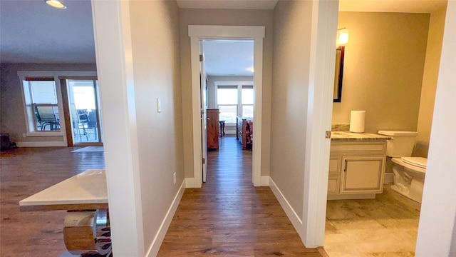 hallway with light wood-type flooring