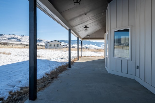 2986 Sunset Ranch Ln, Stevensville, MT 59870 - snow covered patio featuring a mountain view
