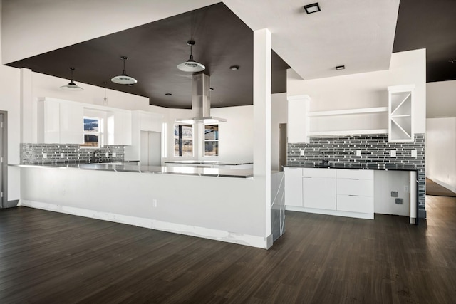 2986 Sunset Ranch Ln, Stevensville, MT 59870 - kitchen with tasteful backsplash, kitchen peninsula, dark hardwood / wood-style floors, and white cabinets