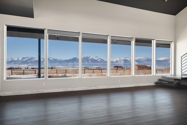 2986 Sunset Ranch Ln, Stevensville, MT 59870 - unfurnished room with dark hardwood / wood-style floors and a mountain view
