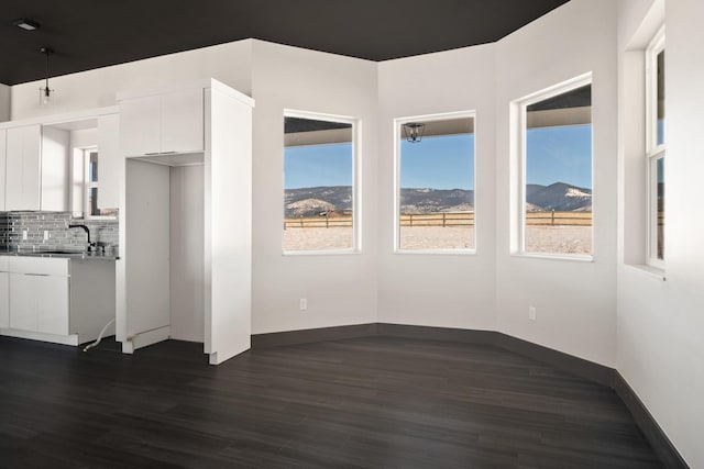 2986 Sunset Ranch Ln, Stevensville, MT 59870 - interior space featuring dark hardwood / wood-style flooring, sink, and a mountain view