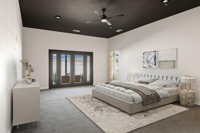2986 Sunset Ranch Ln, Stevensville, MT 59870 - carpeted bedroom with french doors, ceiling fan, and access to exterior